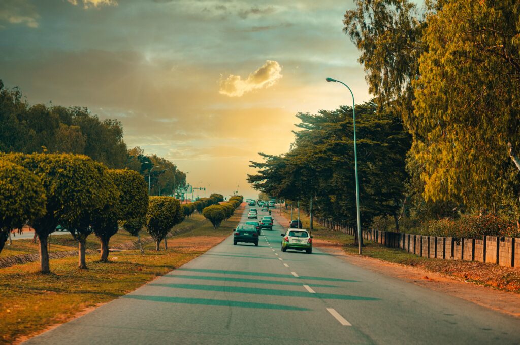 Cars road trees sky sunset