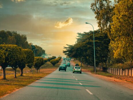 Cars road trees sky sunset