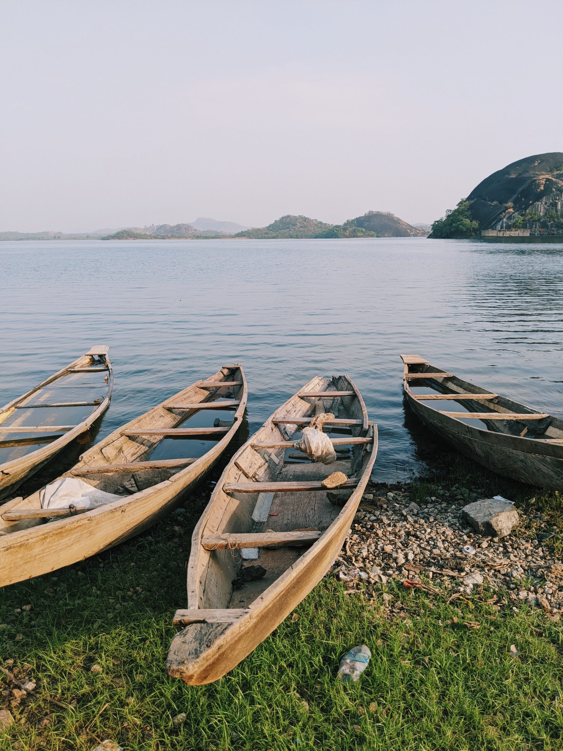 canoes river mountain sky