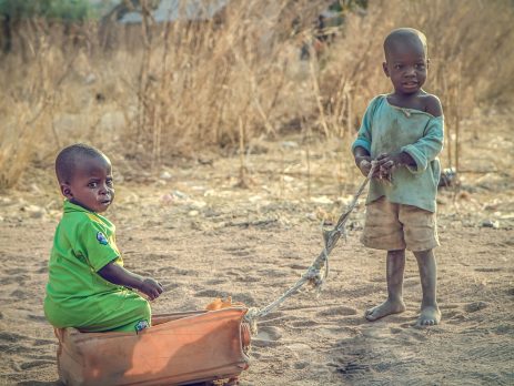 Two Nigerian children playing outdoors